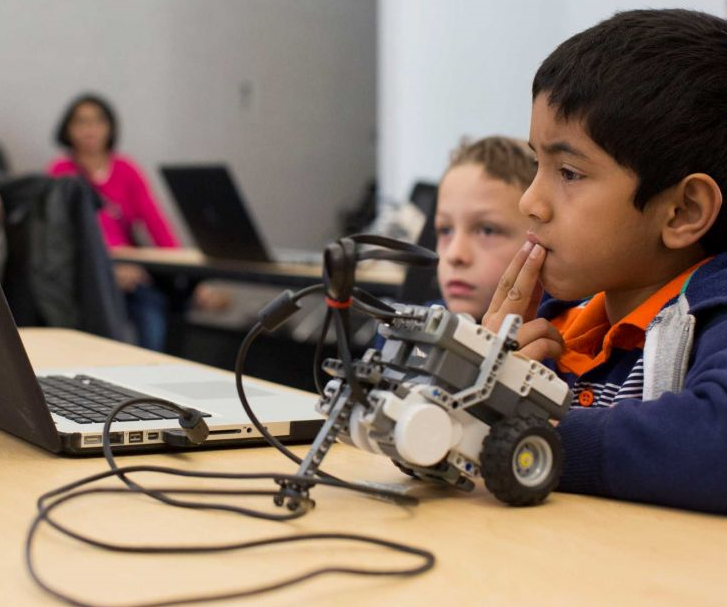 Kids playing with robot