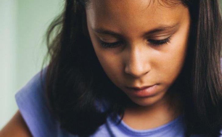 Girl in purple shirt with tool