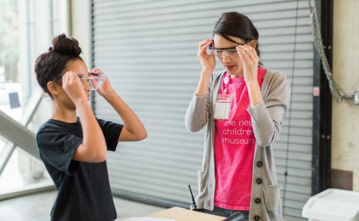 Child and woman wearing goggles